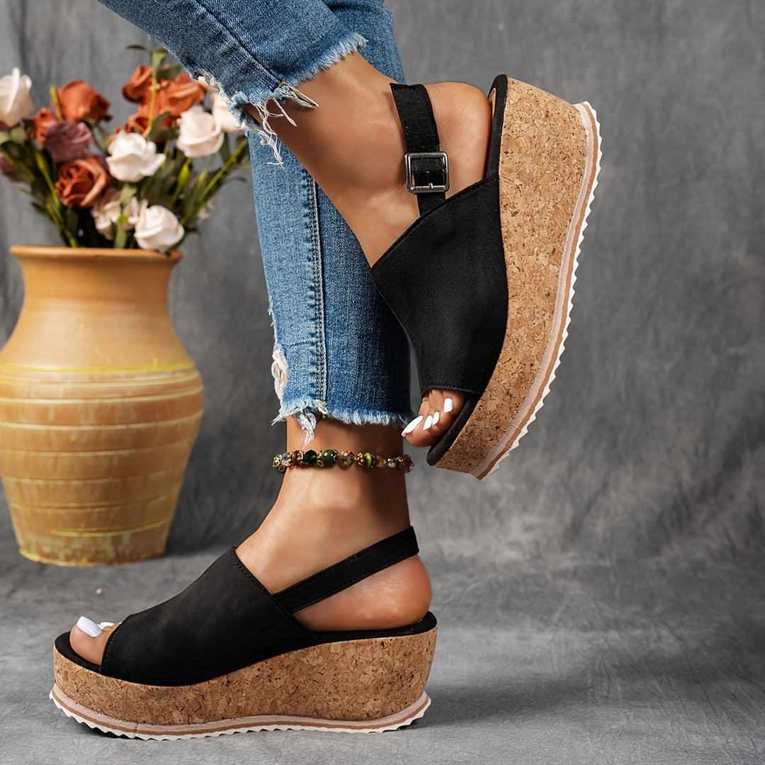 Terra platform sandals in navy blue shown from the side highlighting slim silhouette and platform