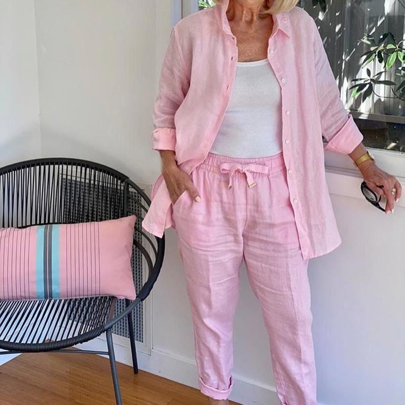 Woman wearing the Terra linen-look two-piece set in pink, featuring a button-front shirt jacket and tapered drawstring pants