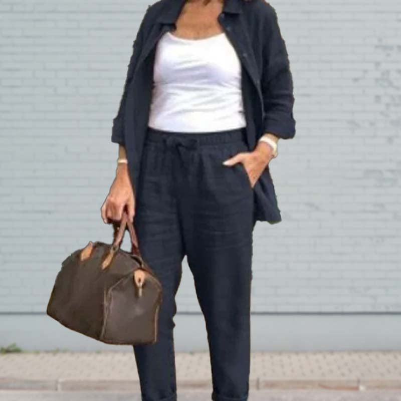 Side view of the Terra linen-look set in dark blue highlighting the relaxed fit and rolled cuff trouser hems
