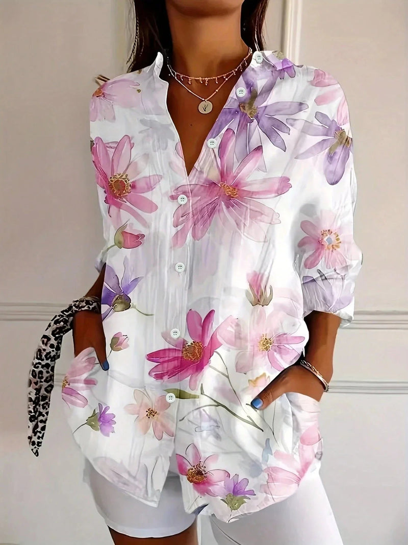 Close-up of the colorful all-over print detail on a lightweight blouse