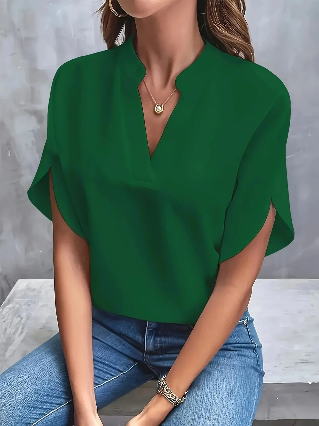 Flat lay of the Thalia tailored blouse in multiple color options including blue, white, and pink