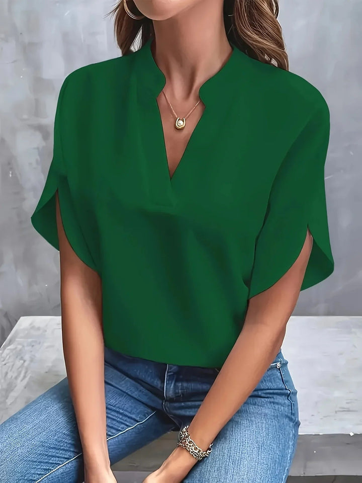 Flat lay of the Thalia tailored blouse in multiple color options including blue, white, and pink