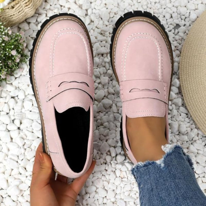 Thalia women's slip-on platform loafers in pink, angled front view showing chunky sole