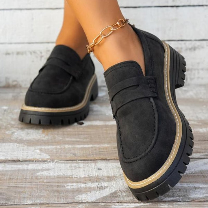 Thalia platform loafers in black styled with straight-leg jeans, lifestyle shot