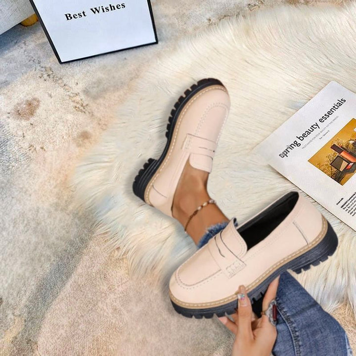 Flat lay of Thalia chunky platform loafers in multiple color options including beige, pink, green, brown, and black