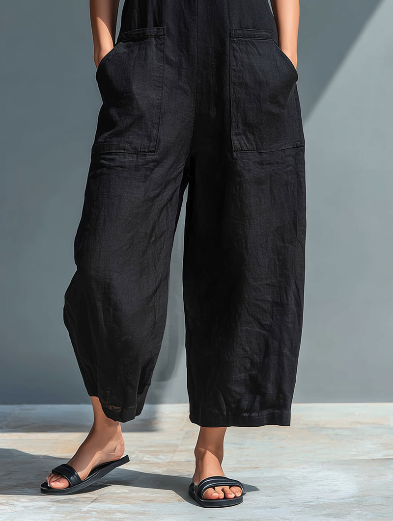Close-up of button-front closure and mandarin collar on Thalia jumpsuit in black