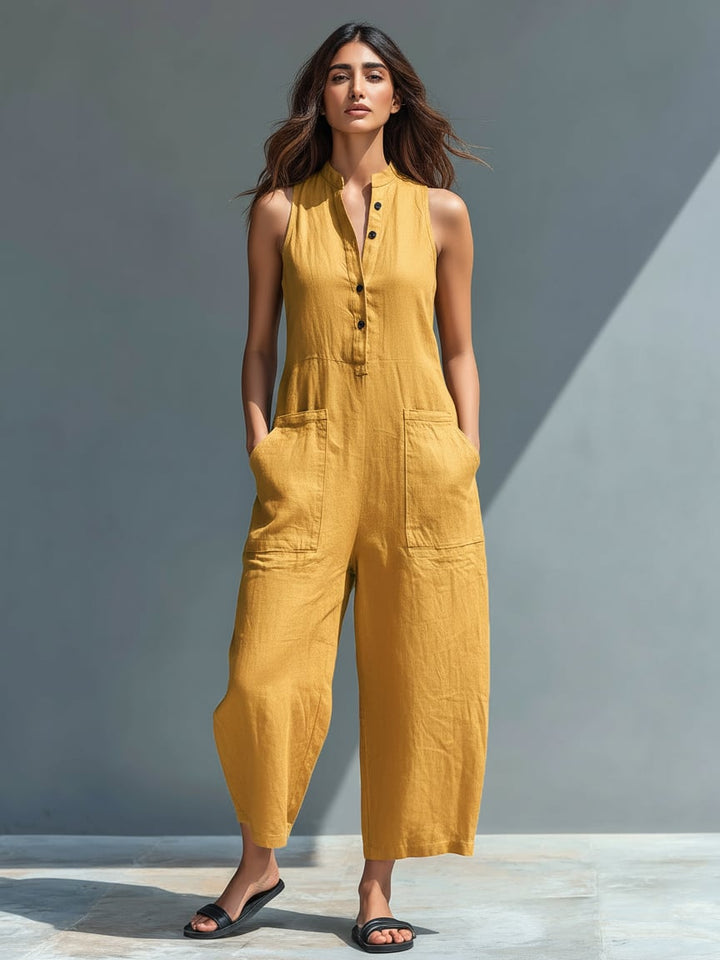 Thalia sleeveless jumpsuit in white styled with sandals for a casual summer look