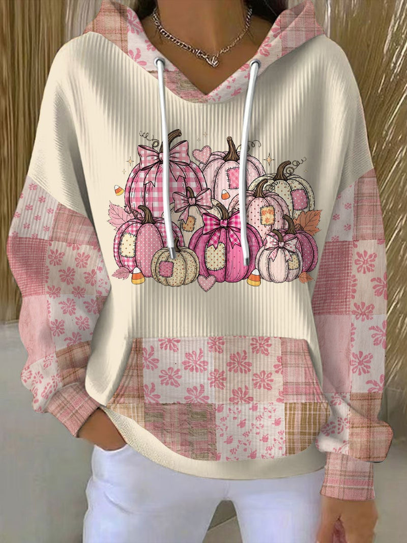Beige relaxed-fit Thanksgiving pumpkin hoodie with a festive fall graphic, shown from the front