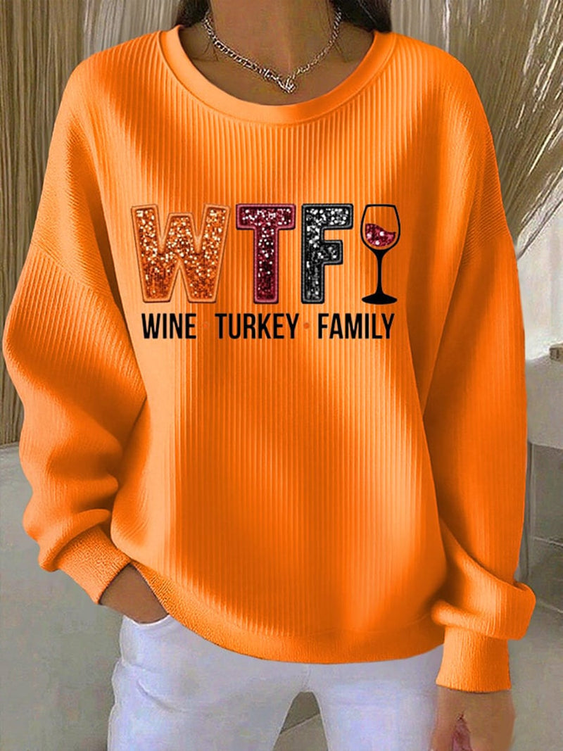 Model wearing an orange relaxed-fit Thanksgiving Spirit Sweatshirt with a festive seasonal graphic print