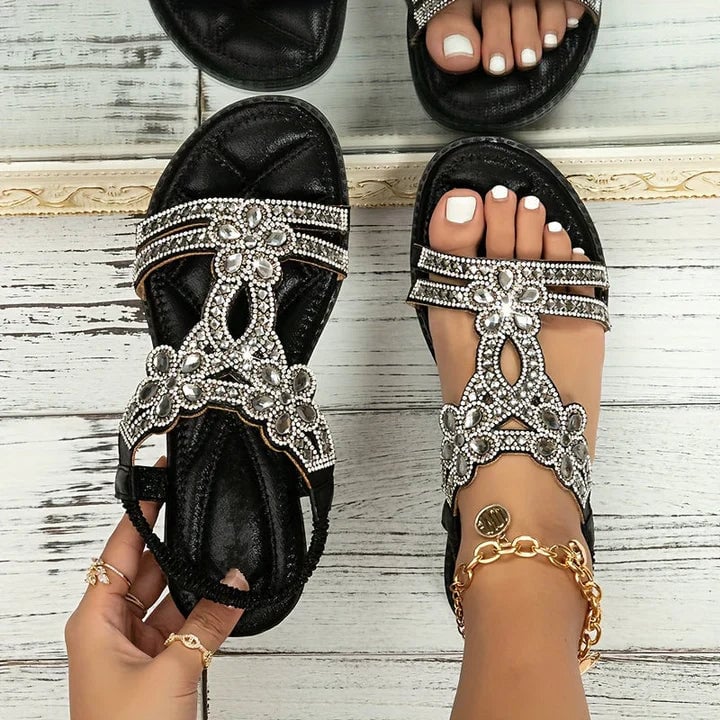 Top-down view of Thea orthopedic sandals in black highlighting boho-inspired textured footbed