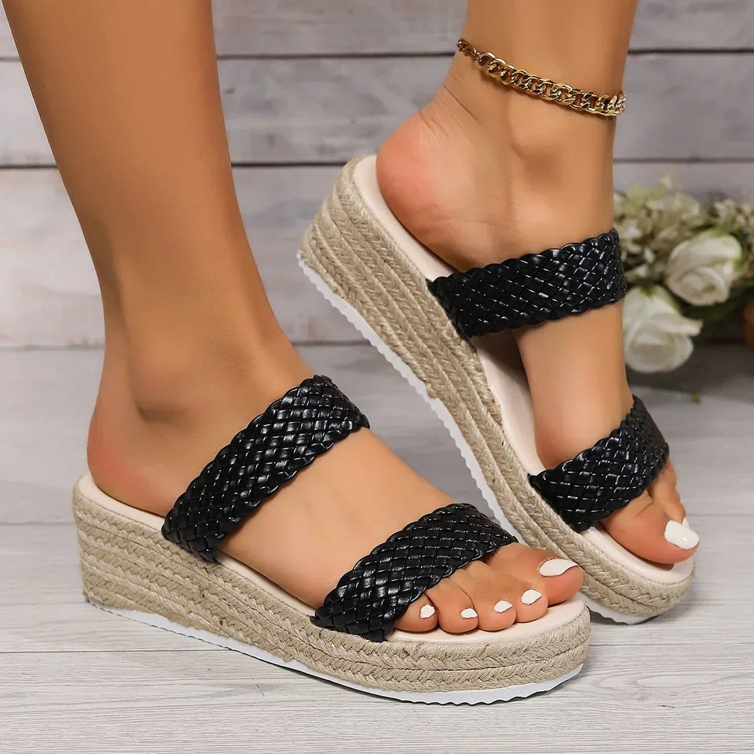 Pair of Theodora brown cushioned wedge sandals, back view showing strap detail