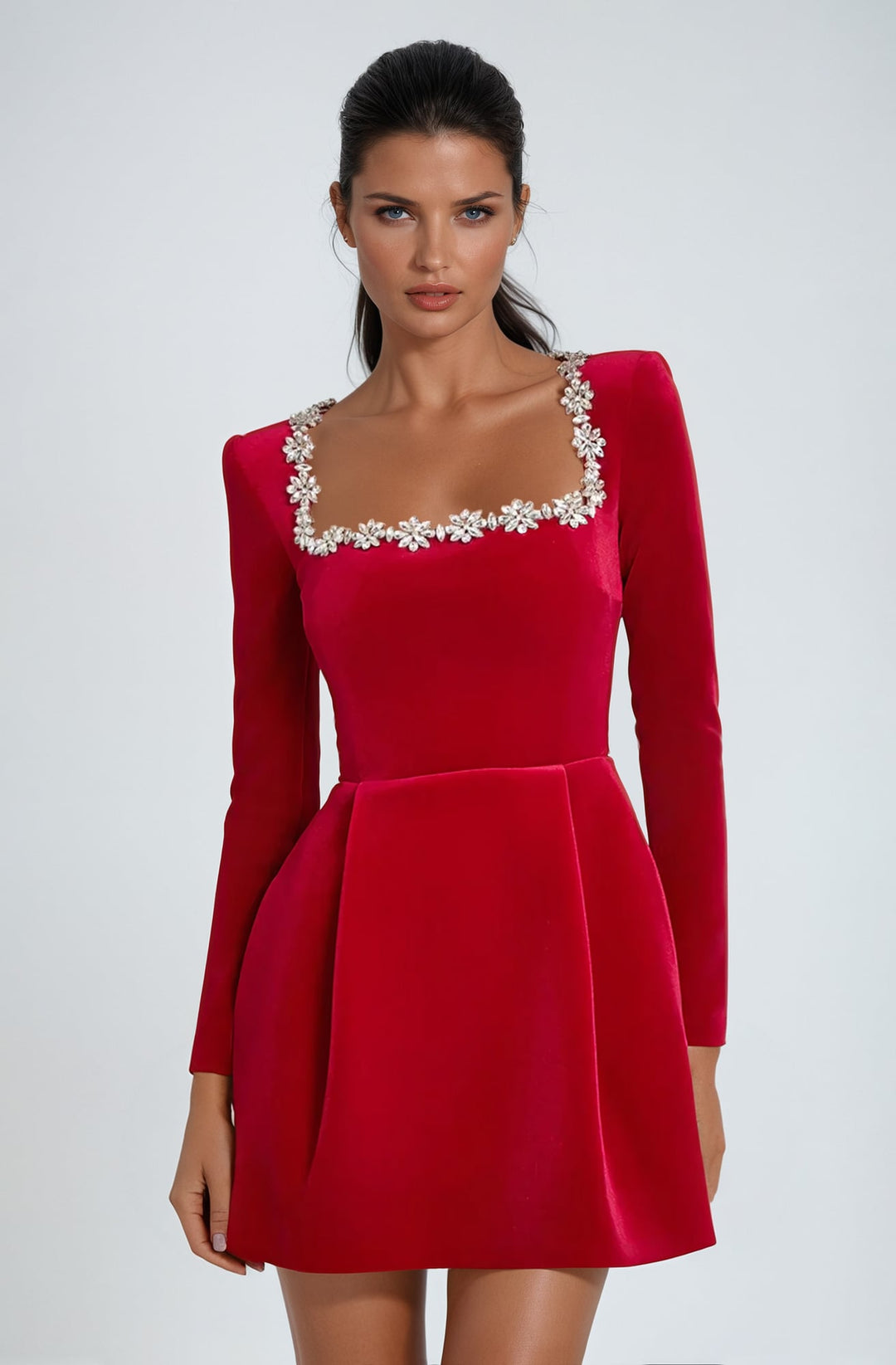 Three-quarter view of the Theodora mini dress in red showing figure-skimming cut and mini hemline