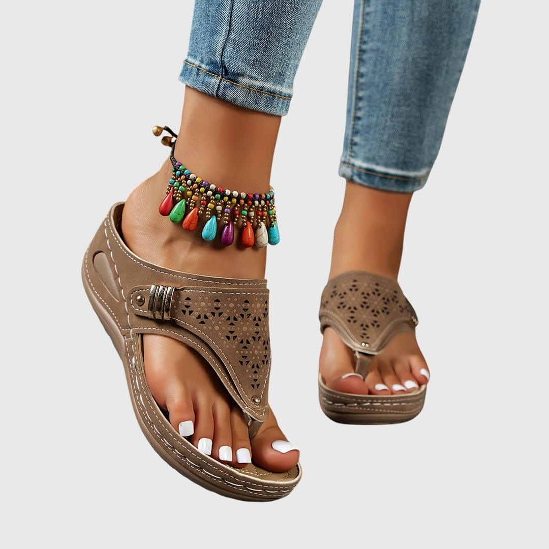 Women's platform ankle strap sandals in burgundy with perforated cutout detail, front view