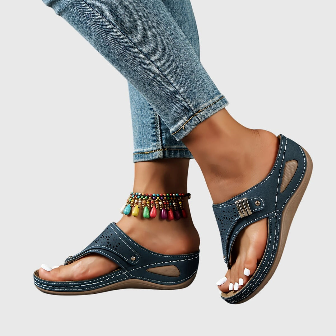 Women's platform ankle strap sandals in black, side view highlighting platform height