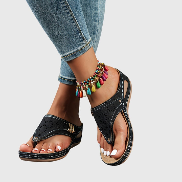 Women's platform ankle strap sandals in navy blue, side view showing ankle strap detail