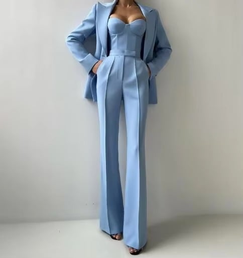 Close-up of single-button notched lapel blazer from women's three-piece coordinated set in green