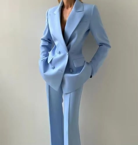 Full-length view of women's three-piece blazer set in purple with flare pants and corset top