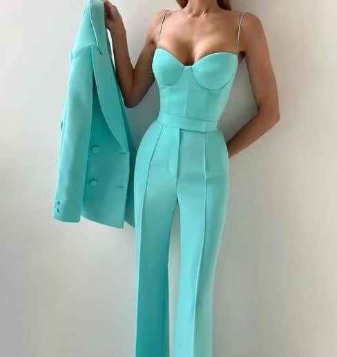 Women's three-piece blazer set styled with heeled mules, showing complete coordinated look