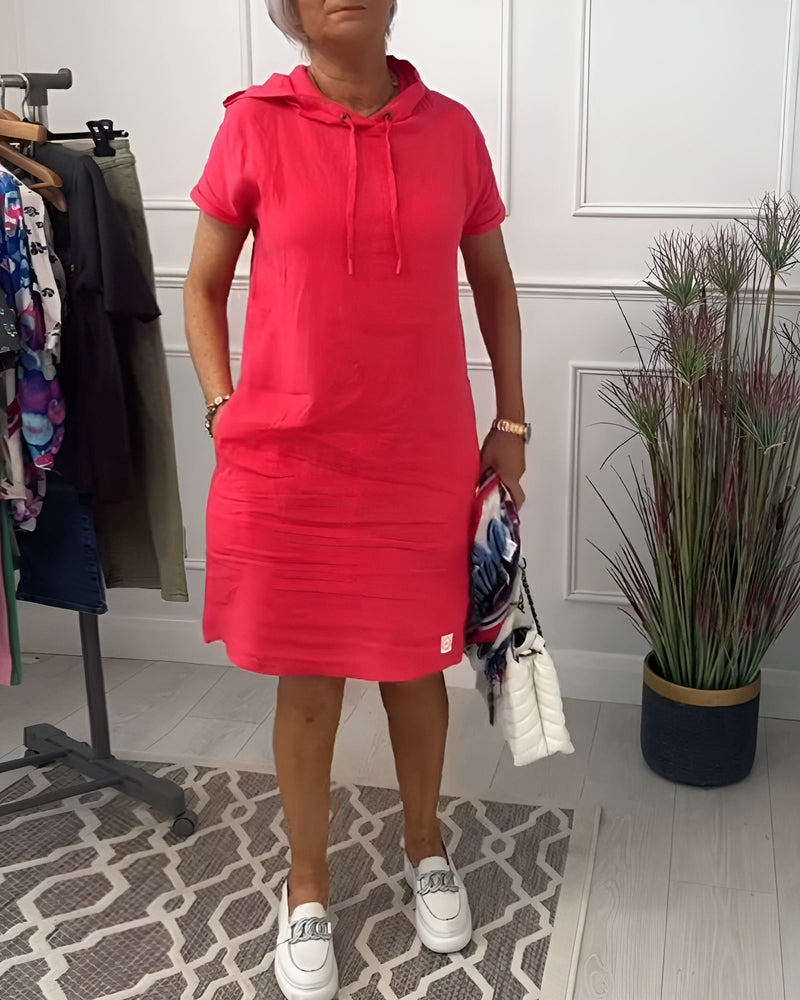 Model wearing a red relaxed hoodie midi dress with half sleeves and a round neckline, full front view