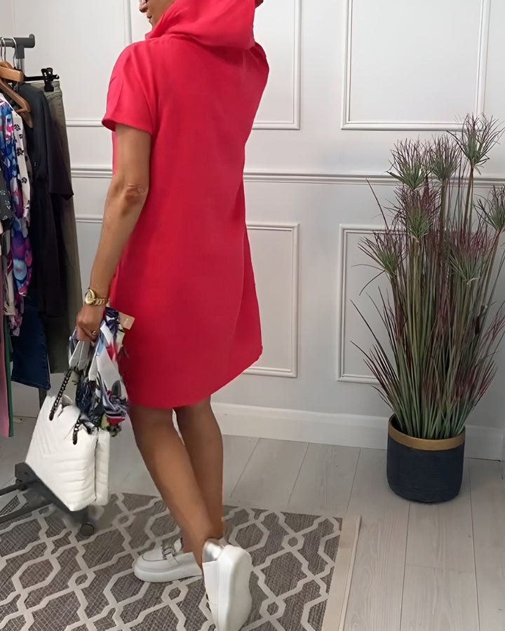 Close-up of the hood detail and round neckline on the relaxed midi dress in red