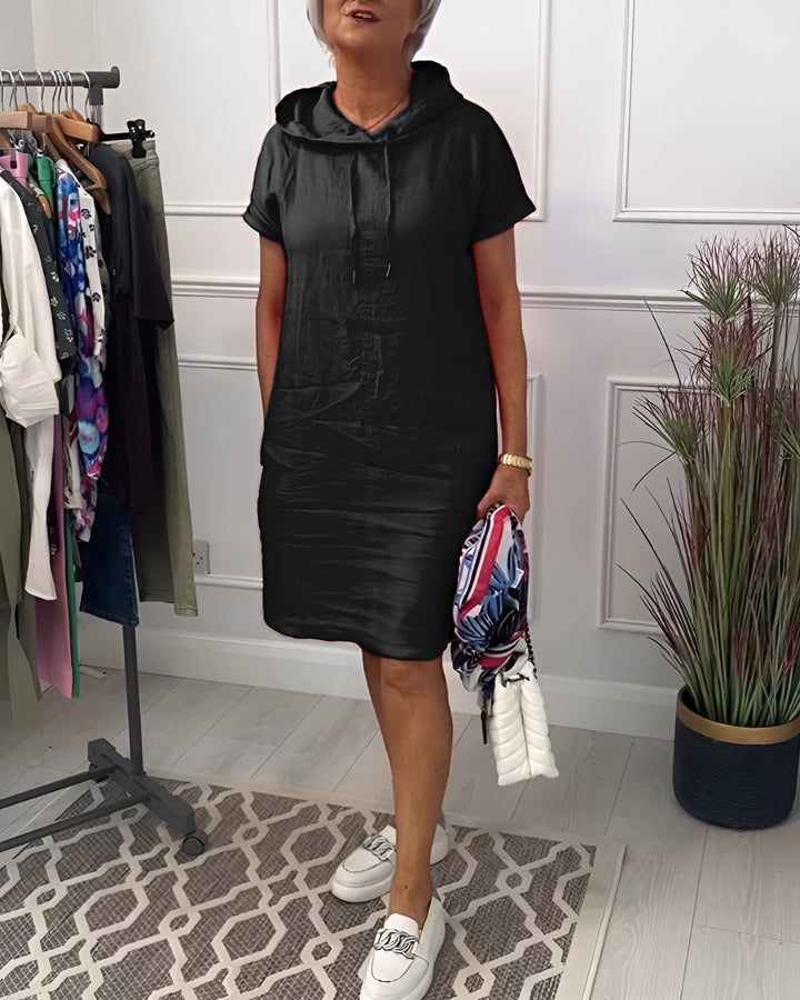 Model in a gray hoodie midi dress showcasing the flattering relaxed silhouette