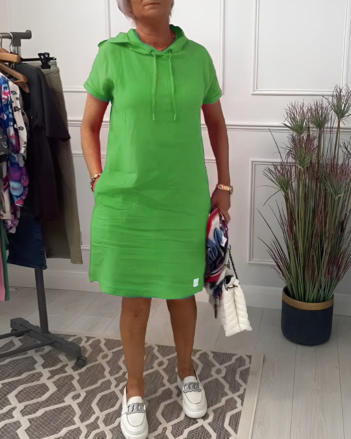 Model walking in the red hoodie midi dress, showing ease of movement