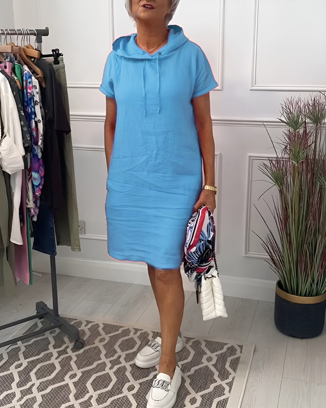 Overhead flat lay of the hoodie midi dress in green showing overall shape