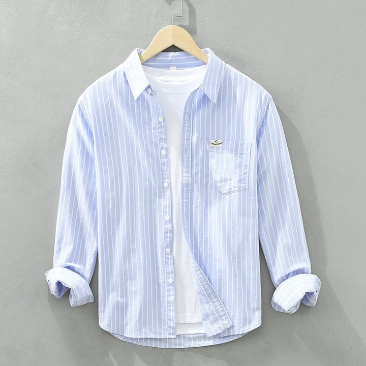 Front view of a striped casual shirt in a relaxed fit with vertical stripe pattern
