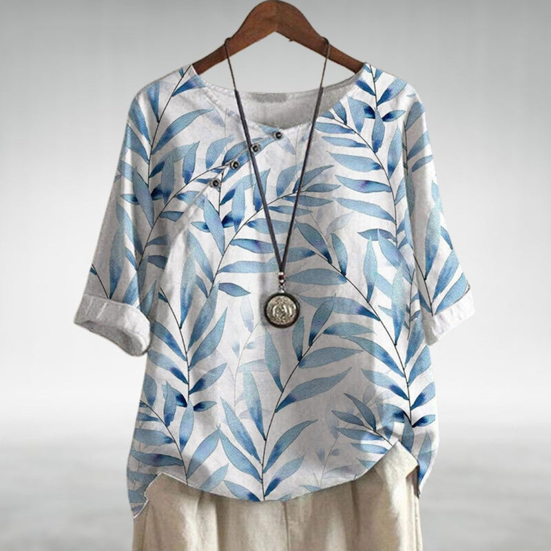 Woman styled in a light breathable blouse paired with jeans for an effortless everyday look