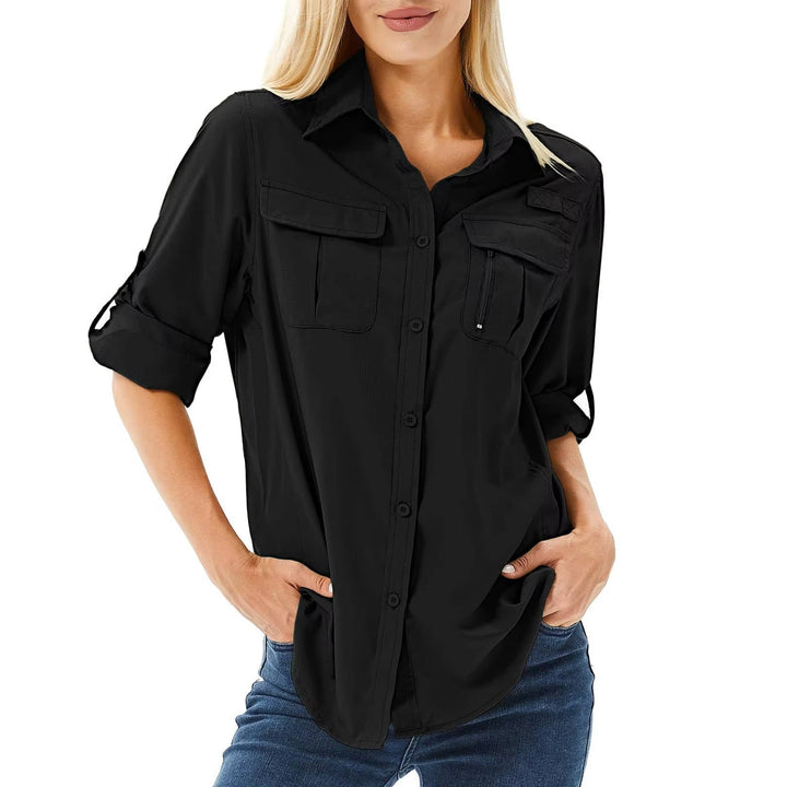 Close-up of the roll-up sleeve button tab detail on a black women's UPF 50 hiking shirt