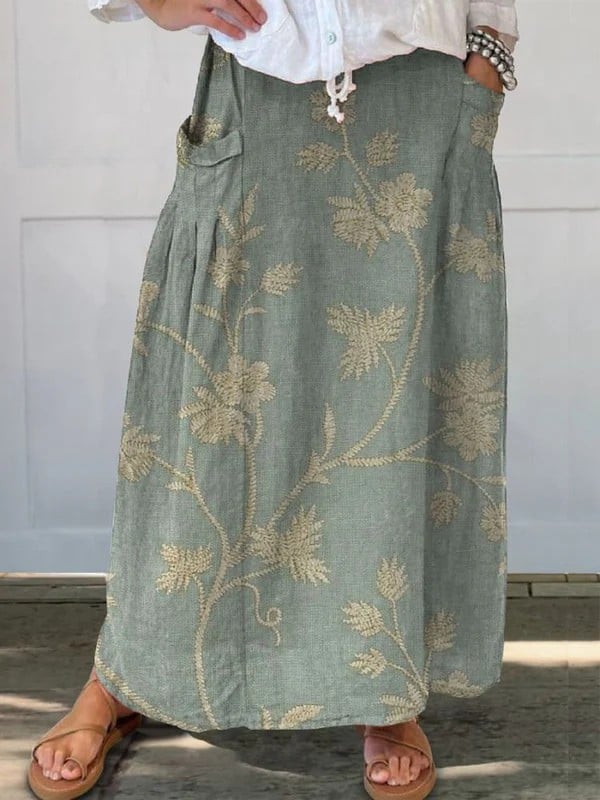 Light gray retro floral A-line skirt with elastic waistband and side pockets, shown in full length