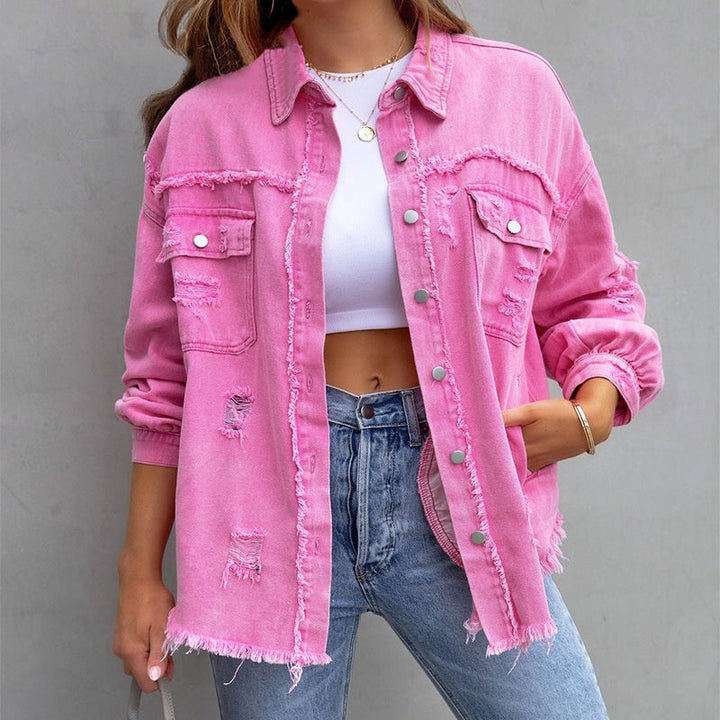 Model wearing a pink distressed vintage-inspired button-down jacket with frayed hem detailing