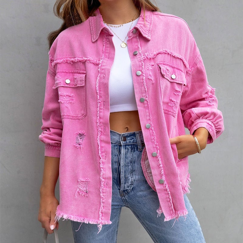Model wearing a pink distressed vintage-inspired button-down jacket with frayed hem detailing