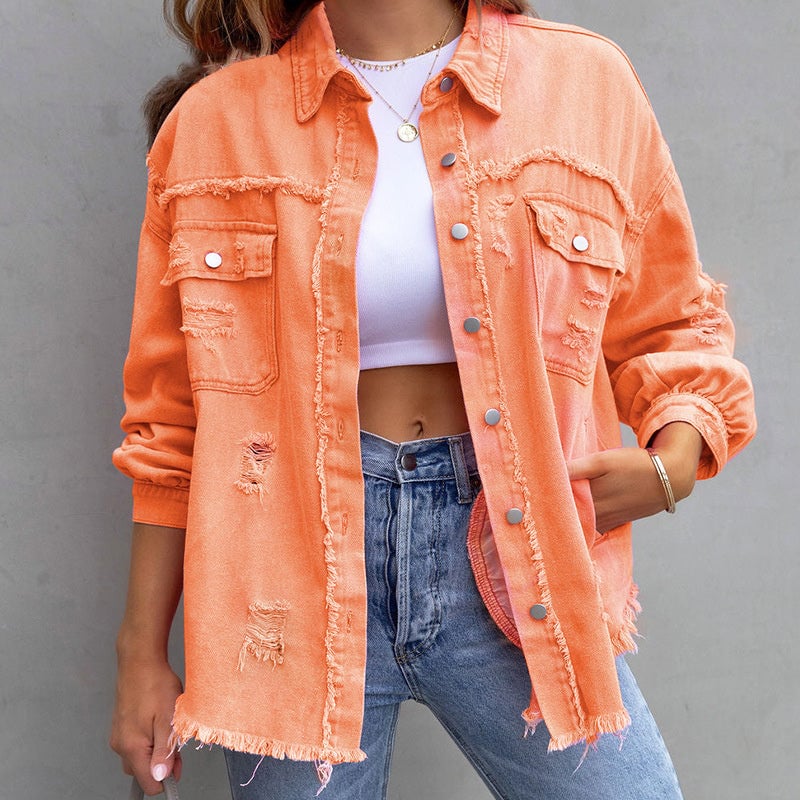 Model styling a vintage-inspired distressed jacket over a casual outfit