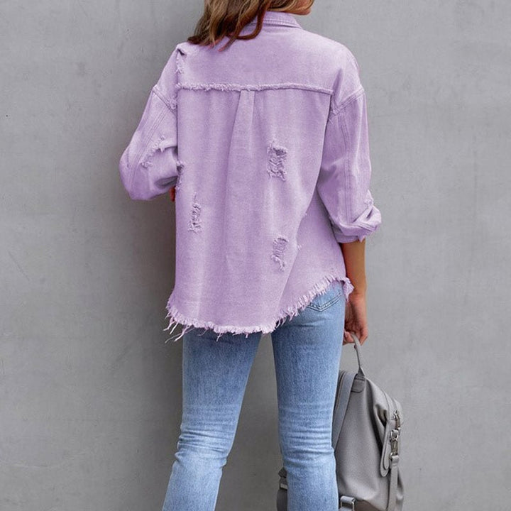 Light green distressed button-down jacket with frayed details on a model