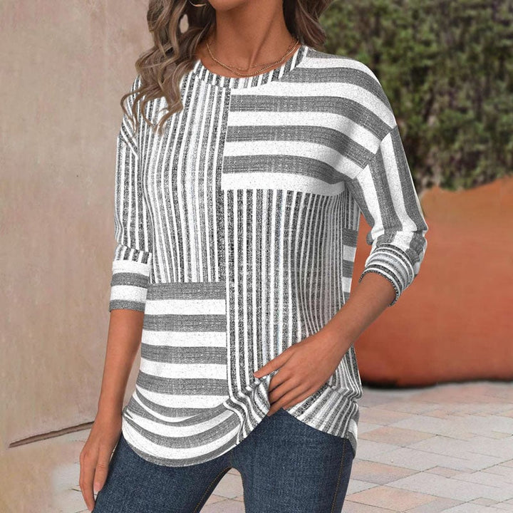 Front view of a striped everyday blouse styled casually, available in sizes S through 5XL