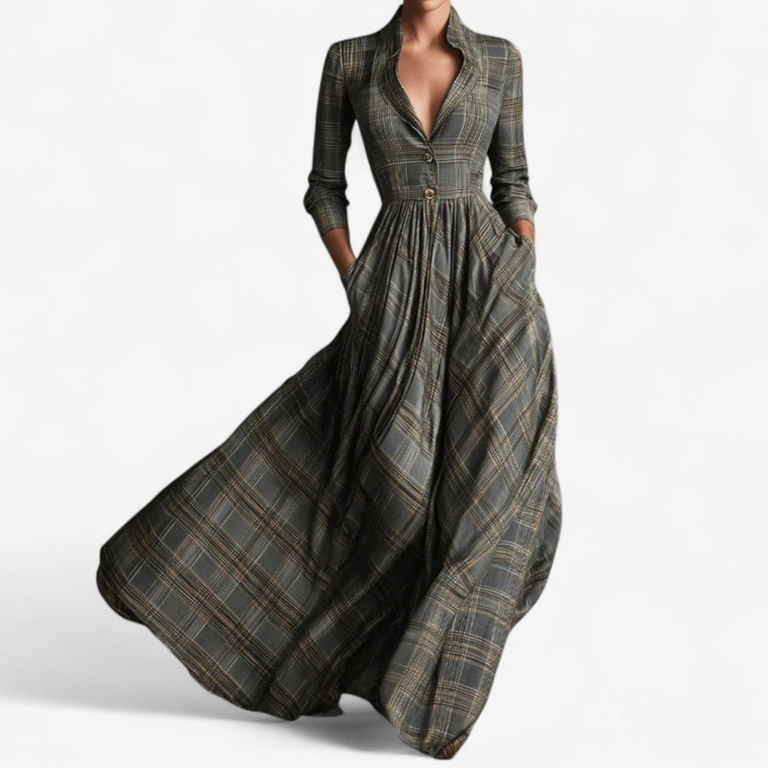 Woman wearing a grey checkered dress with a flattering silhouette, front view