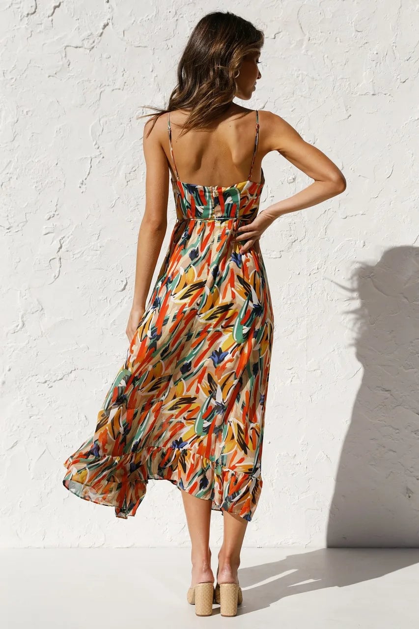 Close-up of the TropicLush Elegant Dress tropical pattern detail in orange