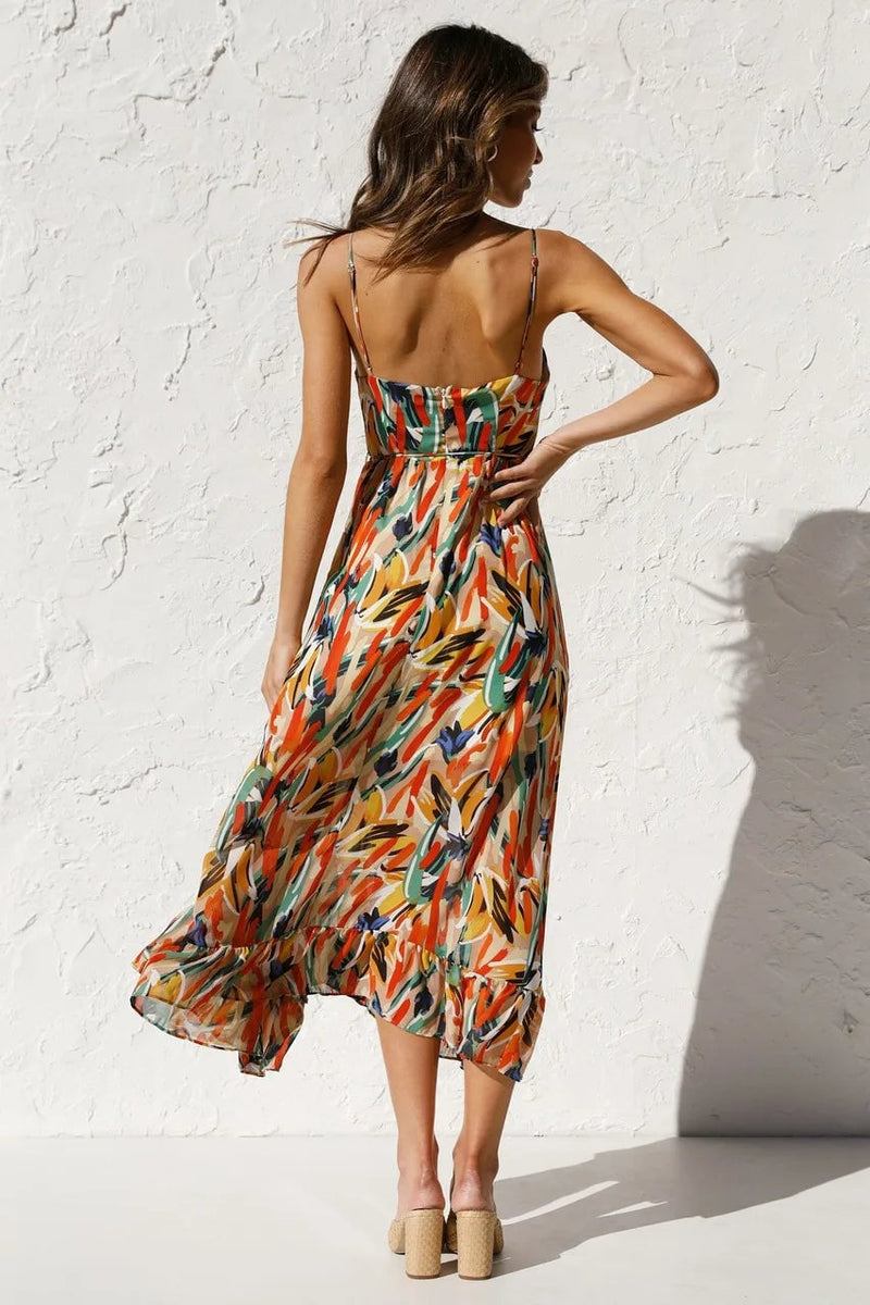 Close-up of the TropicLush Elegant Dress tropical pattern detail in orange