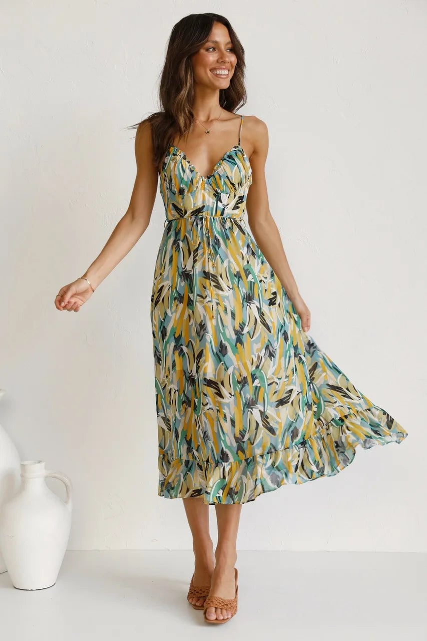Back view of the TropicLush Elegant Dress in green on a model
