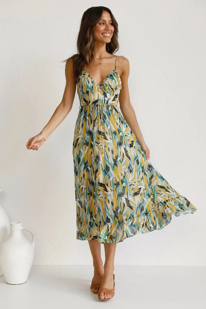 Back view of the TropicLush Elegant Dress in green on a model