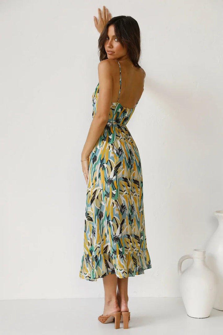 TropicLush Elegant Dress in green displayed on a model showing movement and fit