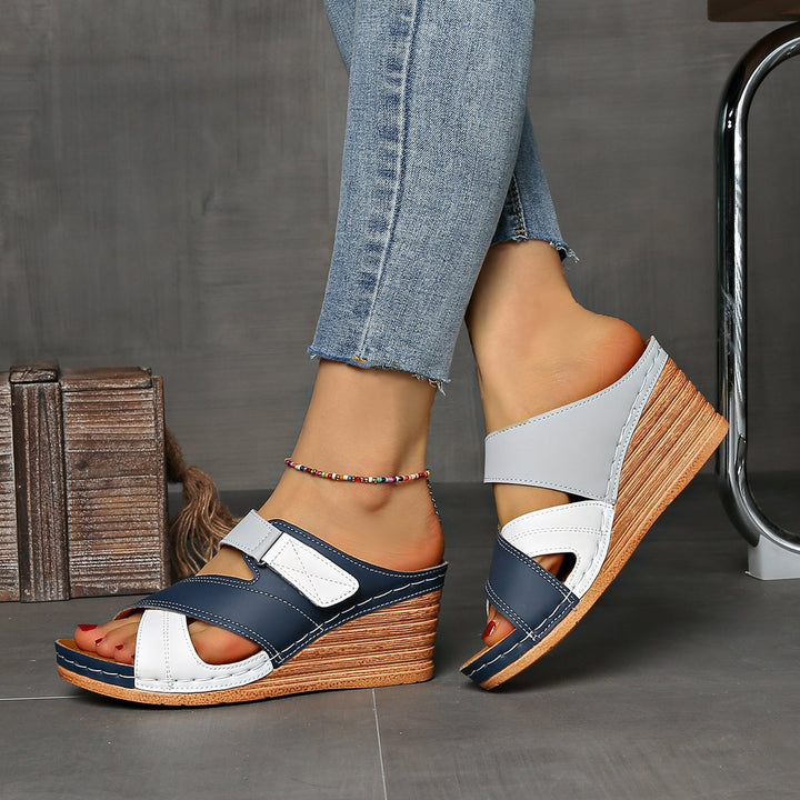 Tulip wedge slides in khaki colorway on a neutral background