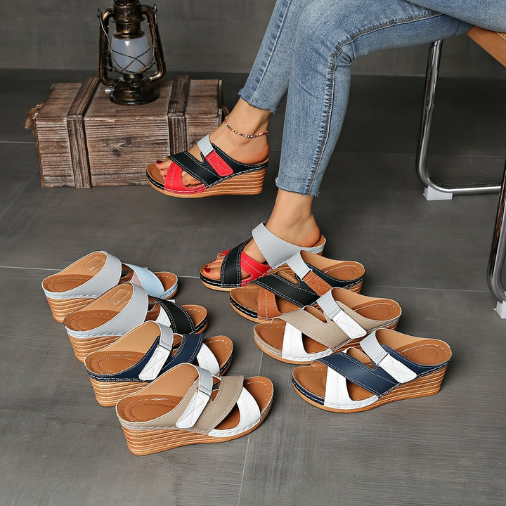 Overhead flat lay of multiple Tulip wedge slide colorways