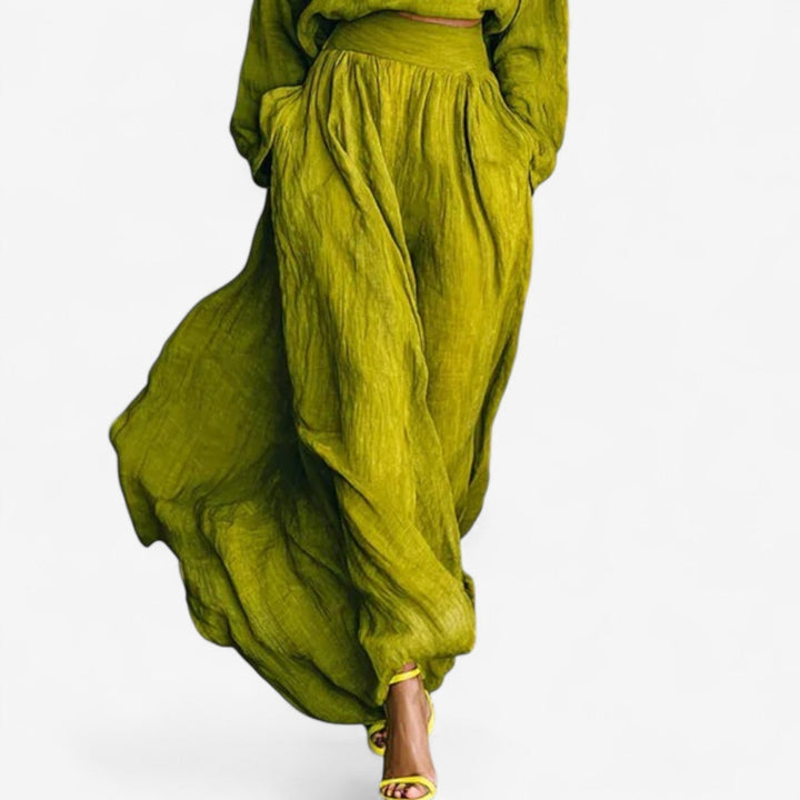 Model styled in the Valencia green dress, dressed up for an evening occasion