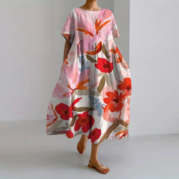 Model styled in the Valentina floral dress in blue, showcasing its flattering cut and ease of movement