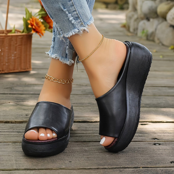 Overhead flat-lay of Valentina sandals in black showing clean lines and sole