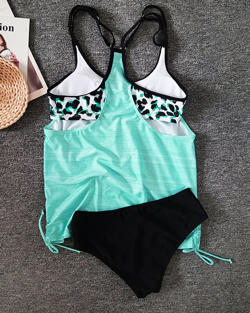 Back view of the Valentina printed tankini in multicolor showing full coverage and smooth fit