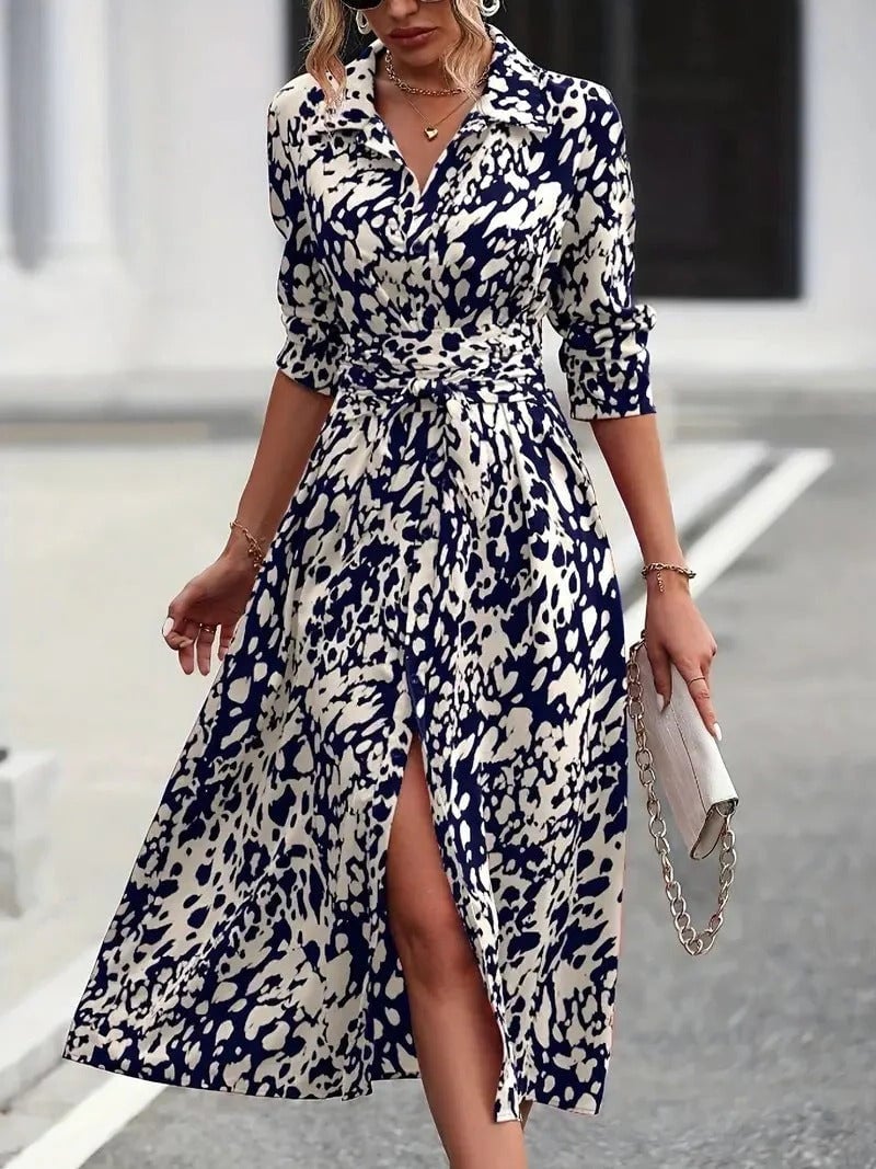 Close-up of the self-tie belt and lapel collar detail on the Valentina abstract-print shirt dress in navy blue