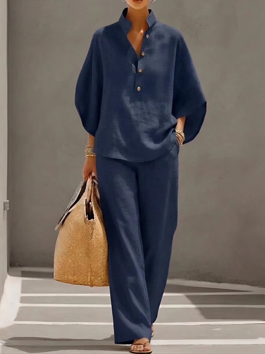 Woman styled in the Valentina matching set in navy blue, full-length view